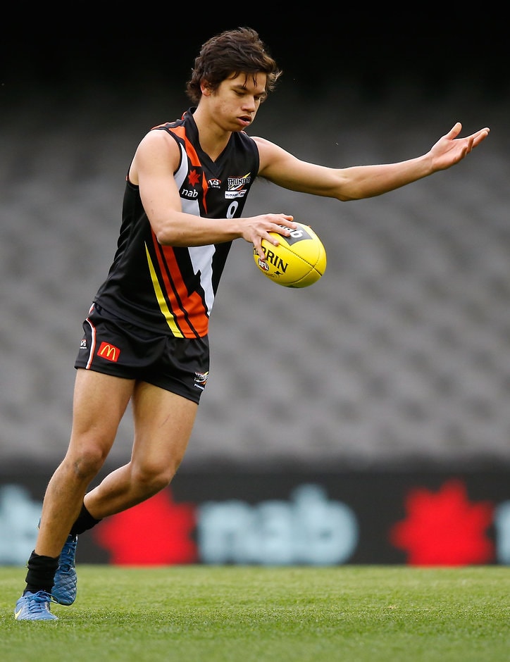 AFL 2015 Under 18 - NT v Tas MELBOURNE, AUSTRALIA - JULY 1: Daniel Rioli of Northern Territory kicks the ball during the 2015 AFL Under 18 match between Northern Territory and Tasmania at Etihad Stadium, Melbourne, Australia on July 1, 2015. (Photo by Adam Trafford/AFL Media)